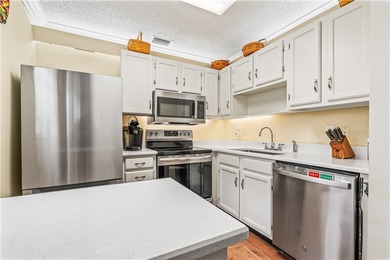 Enjoy easy Florida living in this 2BR/2BA FIRST-FLOOR unit with on The American Golf Club in Florida - for sale on GolfHomes.com, golf home, golf lot