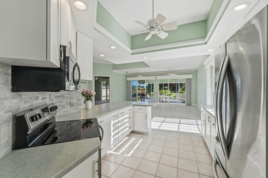 Exceptional 3-bedroom plus office residence located in the gated on Lost Lake Golf Club in Florida - for sale on GolfHomes.com, golf home, golf lot