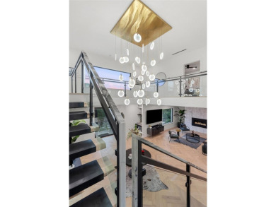Bold, sophisticated, and move-in ready -- this natural modern on Austin Country Club in Texas - for sale on GolfHomes.com, golf home, golf lot