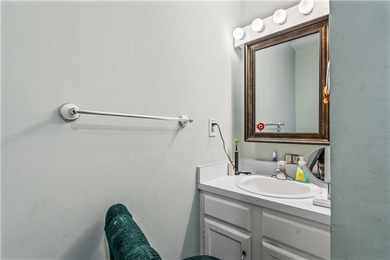 Enjoy easy Florida living in this 2BR/2BA FIRST-FLOOR unit with on The American Golf Club in Florida - for sale on GolfHomes.com, golf home, golf lot