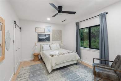 Bold, sophisticated, and move-in ready -- this natural modern on Austin Country Club in Texas - for sale on GolfHomes.com, golf home, golf lot