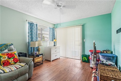 Enjoy easy Florida living in this 2BR/2BA FIRST-FLOOR unit with on The American Golf Club in Florida - for sale on GolfHomes.com, golf home, golf lot