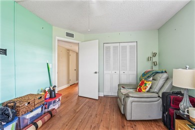 Enjoy easy Florida living in this 2BR/2BA FIRST-FLOOR unit with on The American Golf Club in Florida - for sale on GolfHomes.com, golf home, golf lot