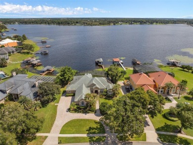 This luxurious estate sits on an amazing lakefront lot on a on Windermere Country Club in Florida - for sale on GolfHomes.com, golf home, golf lot