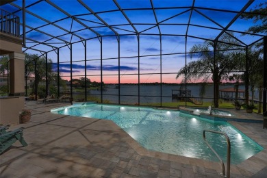 This luxurious estate sits on an amazing lakefront lot on a on Windermere Country Club in Florida - for sale on GolfHomes.com, golf home, golf lot