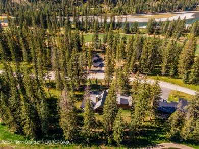 Welcome to a stunning residence nestled within the prestigious on Snake River Sporting Club in Wyoming - for sale on GolfHomes.com, golf home, golf lot