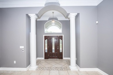 Located in a prestigious gated golf course community, this on Shell Landing Golf Club in Mississippi - for sale on GolfHomes.com, golf home, golf lot