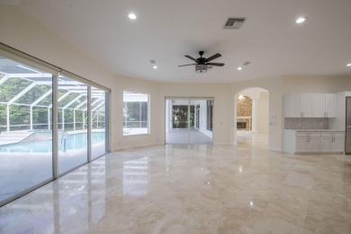 With more than 5,300 square feet under air, this Ecclestone on PGA National Estates Golf Course in Florida - for sale on GolfHomes.com, golf home, golf lot