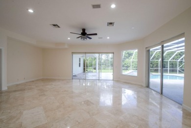 With more than 5,300 square feet under air, this Ecclestone on PGA National Estates Golf Course in Florida - for sale on GolfHomes.com, golf home, golf lot