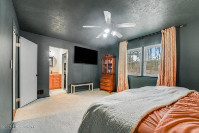 Nestled in the highly sought-after gated community of Doe Valley on Doe Valley Country Club in Kentucky - for sale on GolfHomes.com, golf home, golf lot