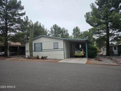 This charming 1995 Palm Harbor home, located in the vibrant 55+ on Pine Shadows Golf Course in Arizona - for sale on GolfHomes.com, golf home, golf lot