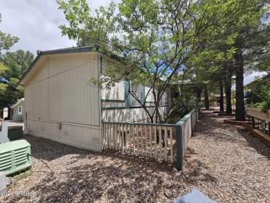 This charming 1995 Palm Harbor home, located in the vibrant 55+ on Pine Shadows Golf Course in Arizona - for sale on GolfHomes.com, golf home, golf lot