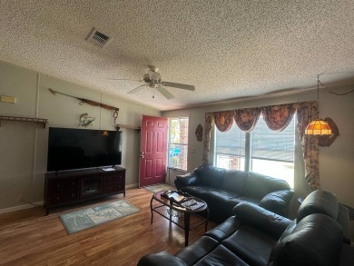This beautiful partially furnished home with a golf cart on Lake Fairways Country Club in Florida - for sale on GolfHomes.com, golf home, golf lot