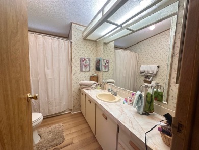 Discover this beautifully maintained two bedroom two bathroom on Whisperwood Golf Course in Florida - for sale on GolfHomes.com, golf home, golf lot