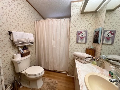 Discover this beautifully maintained two bedroom two bathroom on Whisperwood Golf Course in Florida - for sale on GolfHomes.com, golf home, golf lot