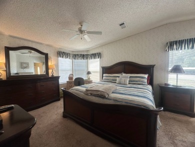 This beautiful partially furnished home with a golf cart on Lake Fairways Country Club in Florida - for sale on GolfHomes.com, golf home, golf lot