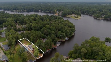 Live the Lake Life every day! This beautifully designed home on River Golf and Country Club at Lake Royale in North Carolina - for sale on GolfHomes.com, golf home, golf lot