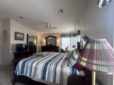 This beautiful partially furnished home with a golf cart on Lake Fairways Country Club in Florida - for sale on GolfHomes.com, golf home, golf lot