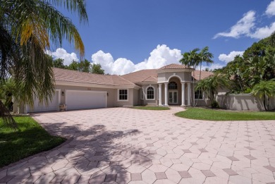 With more than 5,300 square feet under air, this Ecclestone on PGA National Estates Golf Course in Florida - for sale on GolfHomes.com, golf home, golf lot