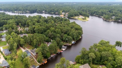 Live the Lake Life every day! This beautifully designed home on River Golf and Country Club at Lake Royale in North Carolina - for sale on GolfHomes.com, golf home, golf lot