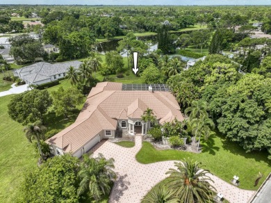 With more than 5,300 square feet under air, this Ecclestone on PGA National Estates Golf Course in Florida - for sale on GolfHomes.com, golf home, golf lot