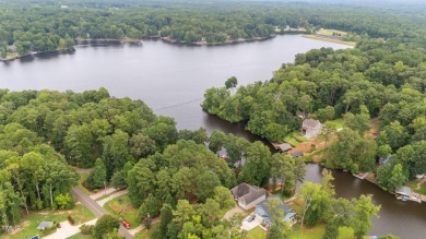 Live the Lake Life every day! This beautifully designed home on River Golf and Country Club at Lake Royale in North Carolina - for sale on GolfHomes.com, golf home, golf lot