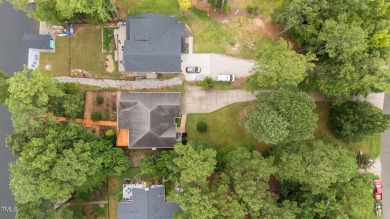 Live the Lake Life every day! This beautifully designed home on River Golf and Country Club at Lake Royale in North Carolina - for sale on GolfHomes.com, golf home, golf lot