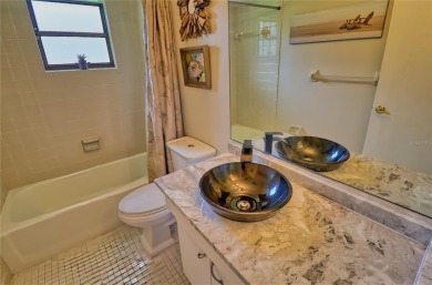 This home is a Head Turner, You are welcomed by the grand double on Palm Aire Country Club of Sarasota in Florida - for sale on GolfHomes.com, golf home, golf lot