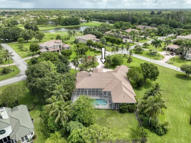 With more than 5,300 square feet under air, this Ecclestone on PGA National Estates Golf Course in Florida - for sale on GolfHomes.com, golf home, golf lot