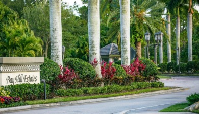 With more than 5,300 square feet under air, this Ecclestone on PGA National Estates Golf Course in Florida - for sale on GolfHomes.com, golf home, golf lot