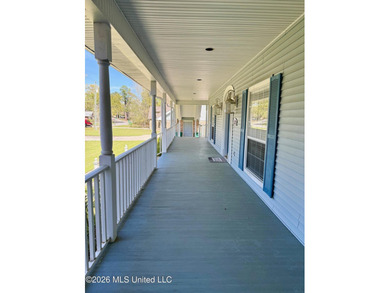 Perfectly positioned on a double lot along the Pine Golf on Diamondhead Country Club in Mississippi - for sale on GolfHomes.com, golf home, golf lot