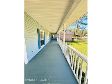 Perfectly positioned on a double lot along the Pine Golf on Diamondhead Country Club in Mississippi - for sale on GolfHomes.com, golf home, golf lot