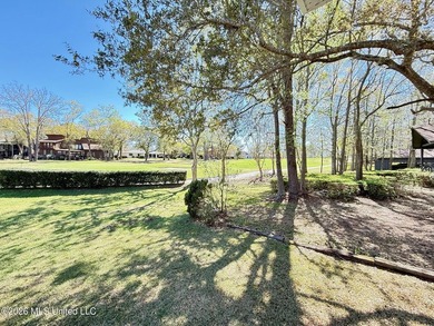 Perfectly positioned on a double lot along the Pine Golf on Diamondhead Country Club in Mississippi - for sale on GolfHomes.com, golf home, golf lot