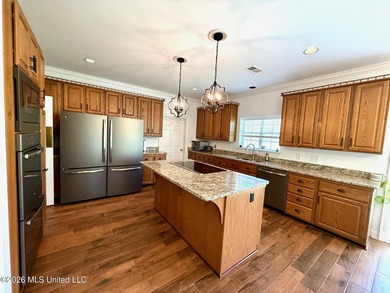 Perfectly positioned on a double lot along the Pine Golf on Diamondhead Country Club in Mississippi - for sale on GolfHomes.com, golf home, golf lot