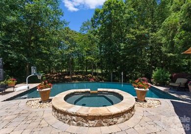 This custom estate embodies luxury, privacy, and timeless on The Palisades Country Club in North Carolina - for sale on GolfHomes.com, golf home, golf lot