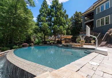 This custom estate embodies luxury, privacy, and timeless on The Palisades Country Club in North Carolina - for sale on GolfHomes.com, golf home, golf lot