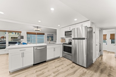 Charming and renovated, this 2-bedroom, 1-bath retreat is on Island Dunes Country Club in Florida - for sale on GolfHomes.com, golf home, golf lot