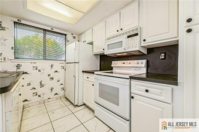 Just over 1000 sq ft, this cozy Timberline floor plan with 2b/2b on Clearbrook Golf Club in New Jersey - for sale on GolfHomes.com, golf home, golf lot