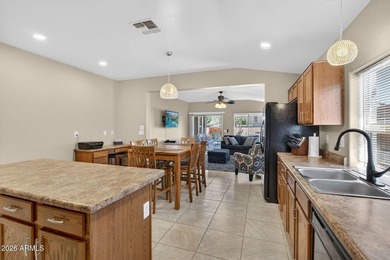 Located in the highly sought-after Johnson Ranch community, this on The Golf Club At Johnson Ranch in Arizona - for sale on GolfHomes.com, golf home, golf lot