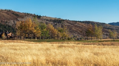 Located near the green of the third hole along the Hale Irwin on Teton Reserve in Idaho - for sale on GolfHomes.com, golf home, golf lot