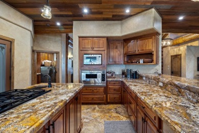 MAGNIFICENT, TURN-KEY FURNISHED FULL LOG CABIN, BACKING NATIONAL on Torreon Golf Club in Arizona - for sale on GolfHomes.com, golf home, golf lot