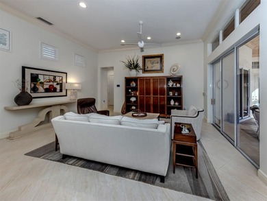 Exuding refined sophistication, this exceptional courtyard on The Venice Golf and Country Club in Florida - for sale on GolfHomes.com, golf home, golf lot