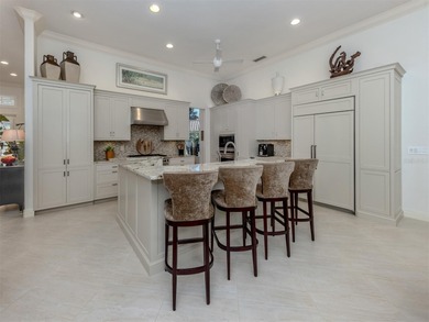 Exuding refined sophistication, this exceptional courtyard on The Venice Golf and Country Club in Florida - for sale on GolfHomes.com, golf home, golf lot