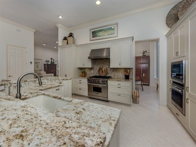 Exuding refined sophistication, this exceptional courtyard on The Venice Golf and Country Club in Florida - for sale on GolfHomes.com, golf home, golf lot