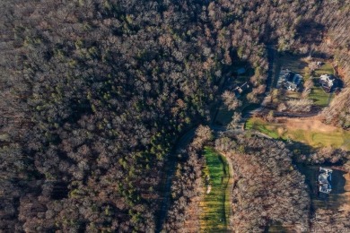 Discover the epitome of tranquility and seclusion with this on The Club at River Oaks in Connecticut - for sale on GolfHomes.com, golf home, golf lot