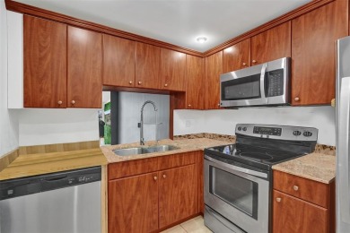 Beautifully updated 2nd-floor condo offering 1 bedroom, 1.5 on Pine Island Ridge Country Club in Florida - for sale on GolfHomes.com, golf home, golf lot