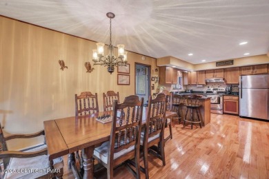 Discover the perfect blend of comfort and charm in this on Lake Naomi Timber Trails Golf Club in Pennsylvania - for sale on GolfHomes.com, golf home, golf lot