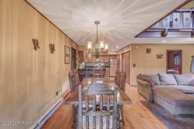 Discover the perfect blend of comfort and charm in this on Lake Naomi Timber Trails Golf Club in Pennsylvania - for sale on GolfHomes.com, golf home, golf lot