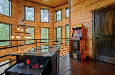 *The Howling Wolf* is a towering getaway cabin at the end of the on Cedar Creek Golf Course At Beavers Bend State Park in Oklahoma - for sale on GolfHomes.com, golf home, golf lot