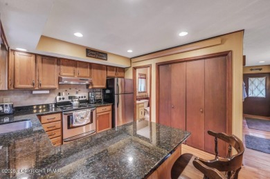 Discover the perfect blend of comfort and charm in this on Lake Naomi Timber Trails Golf Club in Pennsylvania - for sale on GolfHomes.com, golf home, golf lot